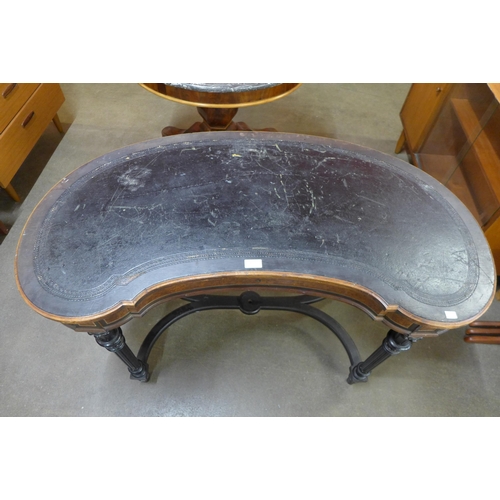 25 - A Victorian Gillows ambonya, ebonised and leather topped kidney shaped writing table