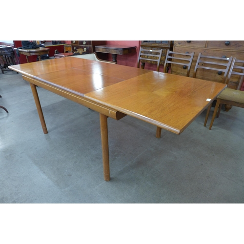 37 - A White & Newton teak extending dining table