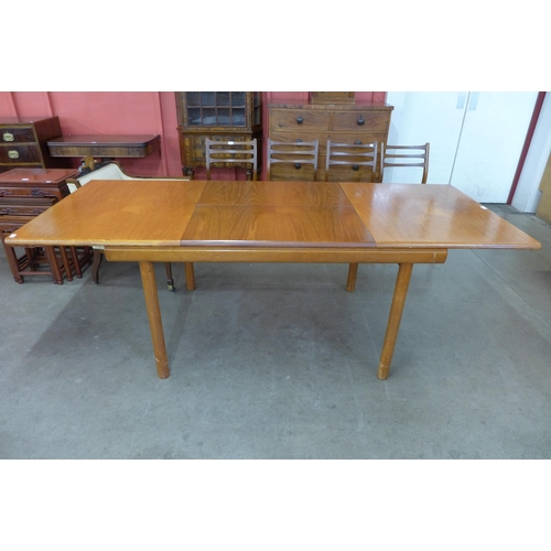 37 - A White & Newton teak extending dining table