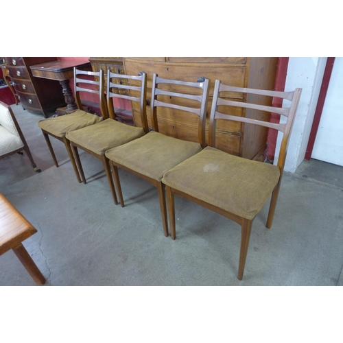 38 - A set of four teak dining chairs