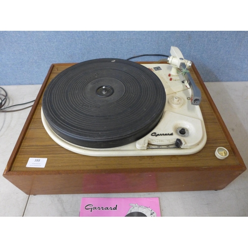 388 - A Garrard Model 4HF record player on wooden base