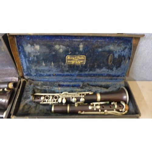 389 - Two clarinets in cases, including one Boosey and Hawkes