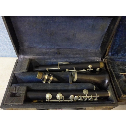 389 - Two clarinets in cases, including one Boosey and Hawkes