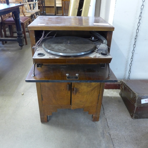 392 - A Plusagram record player in self-contained unit with record storage below