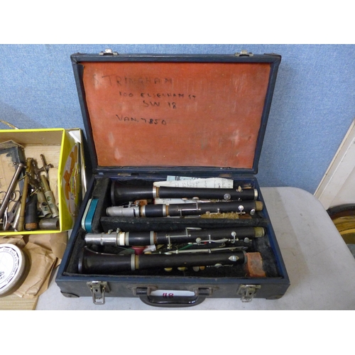 399 - Musical instrument parts/accessories, two clarinets in case and a HMV wireless radio in wooden case