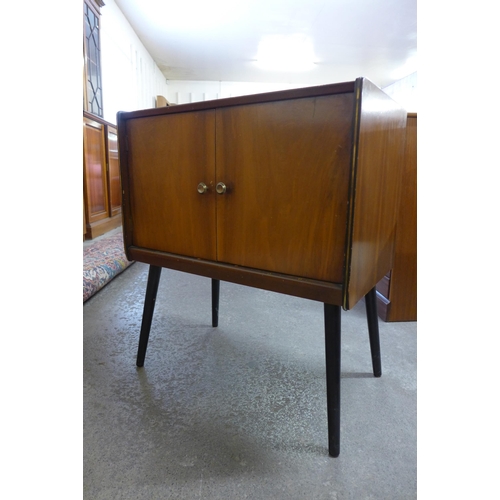 47 - A walnut two door record cabinet