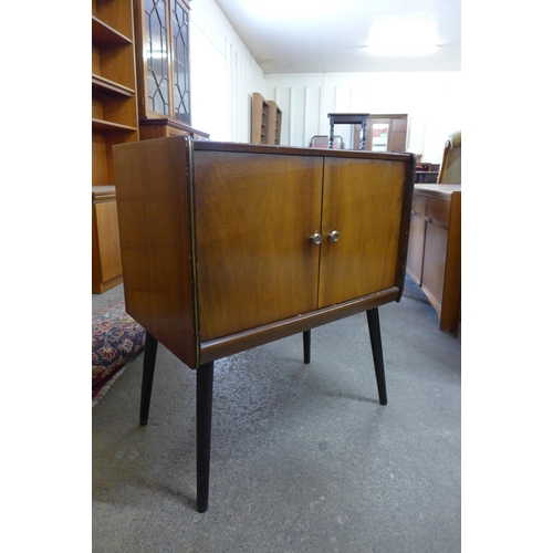 47 - A walnut two door record cabinet