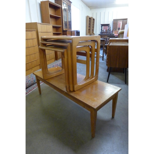 48 - A beech nest of tables and a teak coffee table