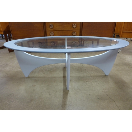 60 - A G-Plan Astro painted teak and glass topped oval coffee table