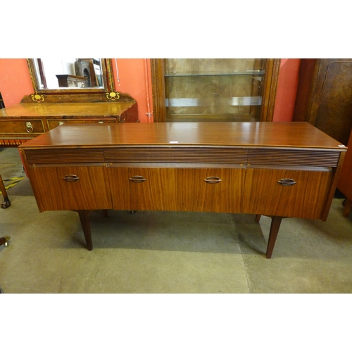 87 - An Elliotts of Newbury afromosia concave sideboard