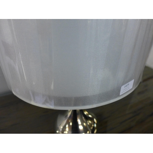 1425 - A mirrored glass table lamp with champagne shade