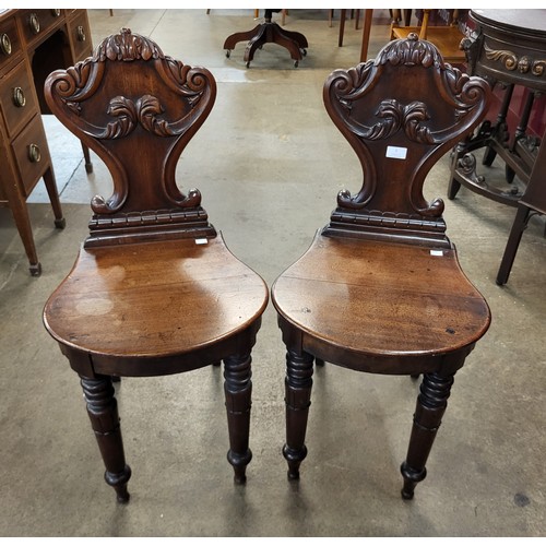 1 - A pair of William IV mahogany hall chairs