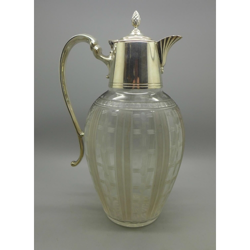 616 - A claret jug with silver plated top