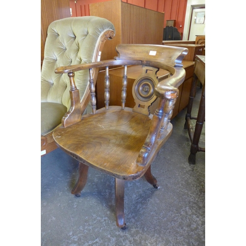 145 - A Victorian elm and beech revolving Captains desk chair