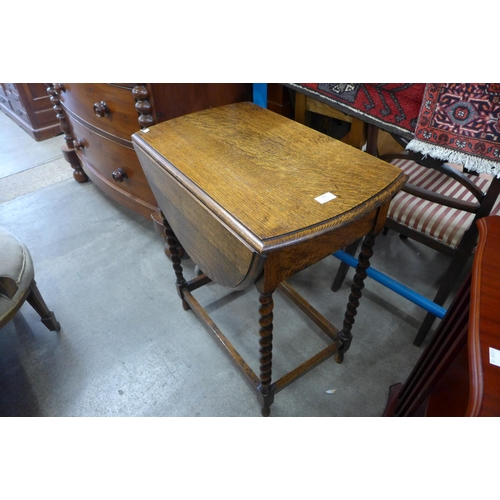 163 - An oak barleytwist drop leaf table