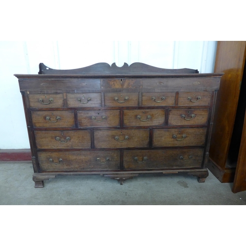 175 - A George II inlaid mahogany fourteen drawer Lancashire chest