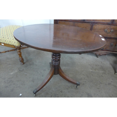 177 - A George IV mahogany oval tilt-top tripod table