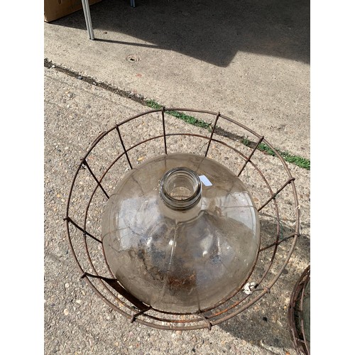 2071 - Glass carboy jar in metal cage