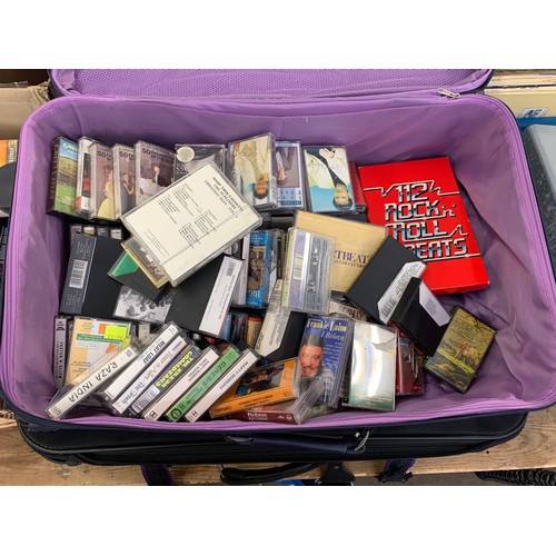 2104 - Picnic basket and 2 useable suitcases with approx 80 cassette tapes and 180CDs and DVDs