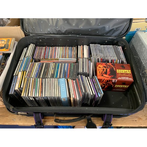 2104 - Picnic basket and 2 useable suitcases with approx 80 cassette tapes and 180CDs and DVDs