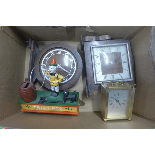 1031 - A tin-plate clockwork seal, three clocks, cast metal money-bank, plastic soldiers and a model of a W... 