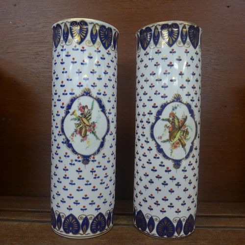 611 - A pair of continental cylindrical vases, 24.5cm