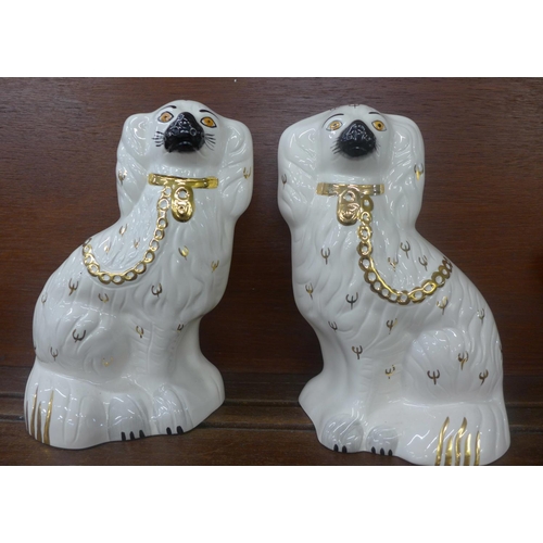 614 - A pair of Royal Doulton Staffordshire spaniels, 23cm