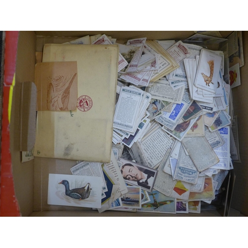 665 - Cigarette cards:- a box of cigarette and trade cards, in albums and loose