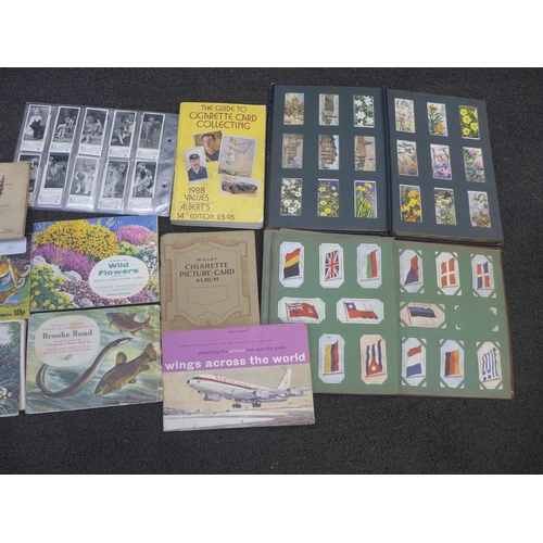 665 - Cigarette cards:- a box of cigarette and trade cards, in albums and loose