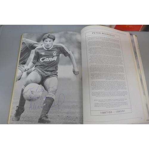 666 - Football:- four football books relating to Liverpool FC containing signatures from former players, i... 