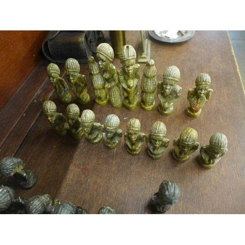 706 - An African carved soapstone chess set