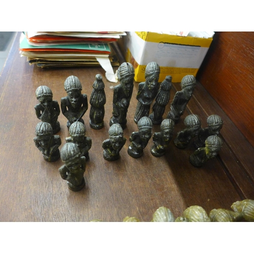 706 - An African carved soapstone chess set