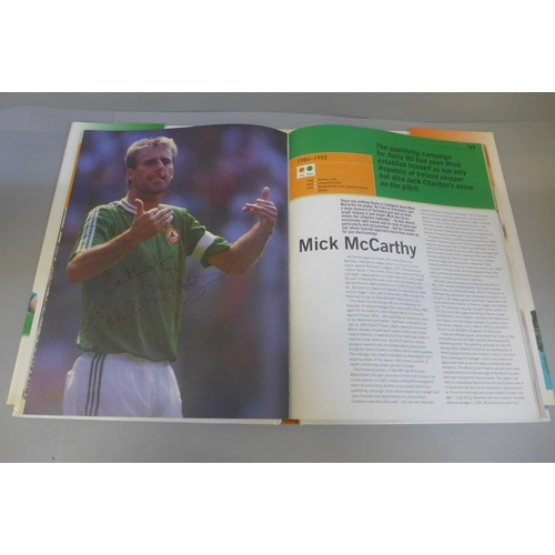 748 - Football:- three World Cup related books containing signatures from former players including Sol Cam... 