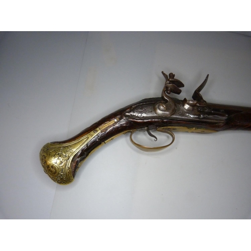 818 - An 18th Century flintlock pistol, 47cm, later trigger guard