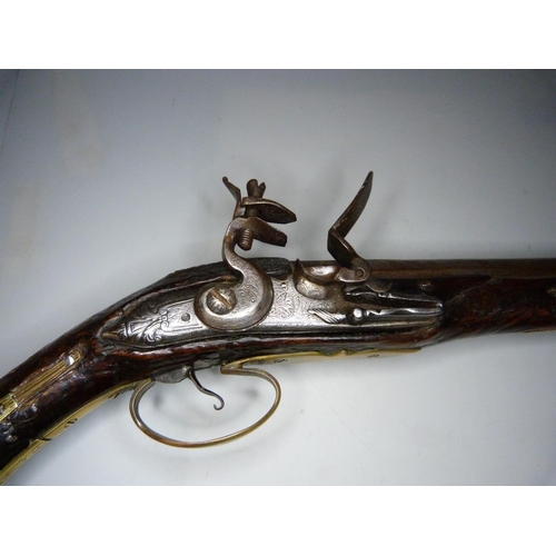 818 - An 18th Century flintlock pistol, 47cm, later trigger guard