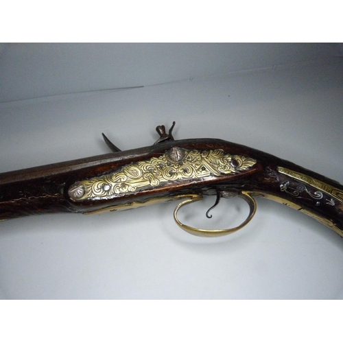 818 - An 18th Century flintlock pistol, 47cm, later trigger guard