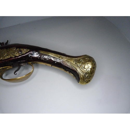 818 - An 18th Century flintlock pistol, 47cm, later trigger guard