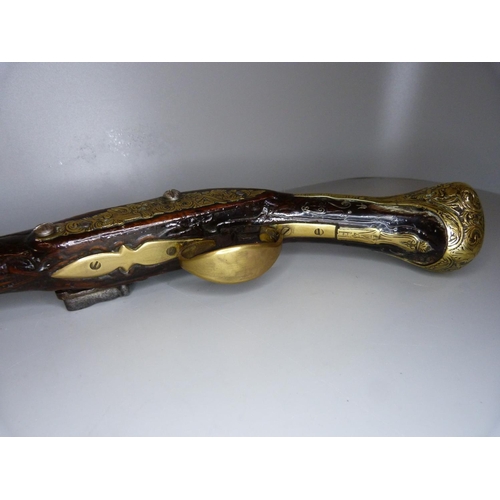 818 - An 18th Century flintlock pistol, 47cm, later trigger guard