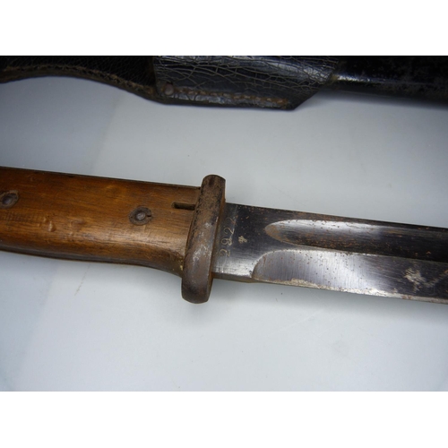 819 - A WWII Seitengewehr 84/98 bayonet with metal scabbard and leather frog, the blade marked 42asw and 2... 