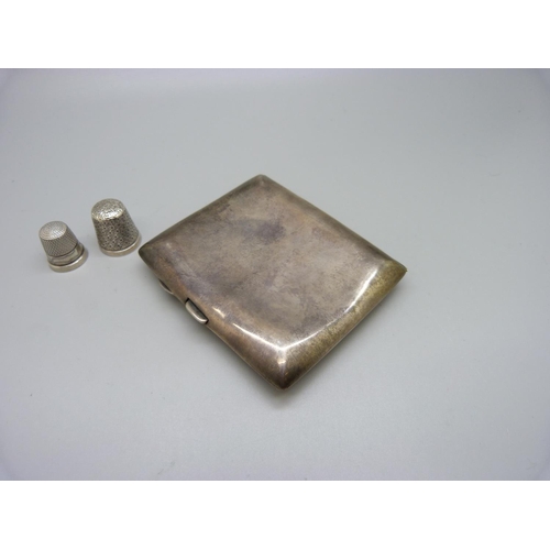 837 - A silver cigarette case, with monogram, 84g, a silver thimble and one other thimble