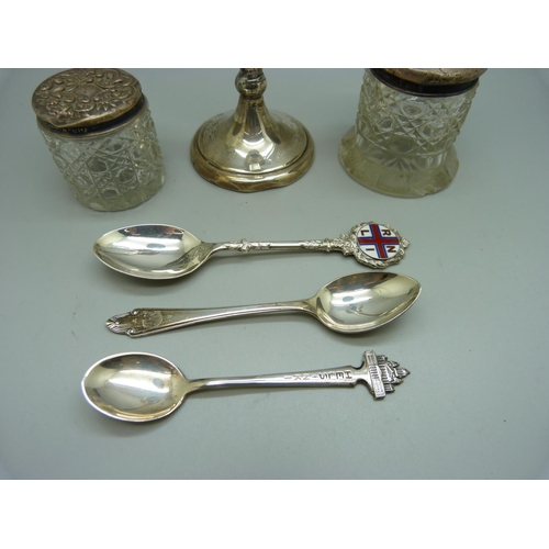 846 - Two silver topped glass jars, a/f, a silver posy vase and three silver spoons, including one 830 sil... 