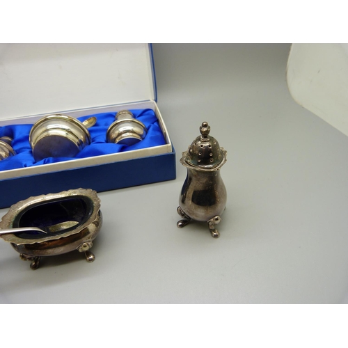 848 - A silver condiment set, 56g, boxed and a plated condiment set