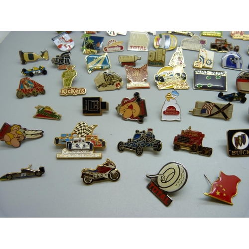 853 - A collection of pin badges