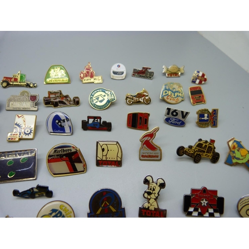 853 - A collection of pin badges