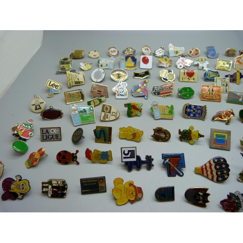 855 - A collection of pin badges