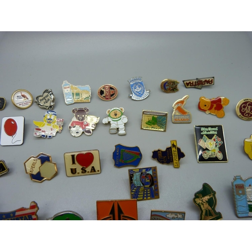 855 - A collection of pin badges