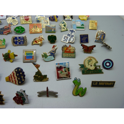 855 - A collection of pin badges