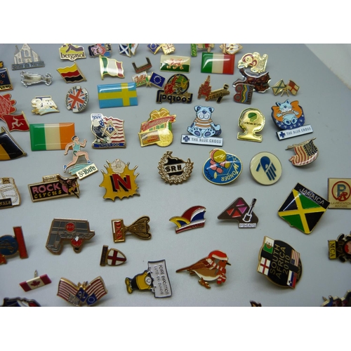 856 - A collection of pin badges