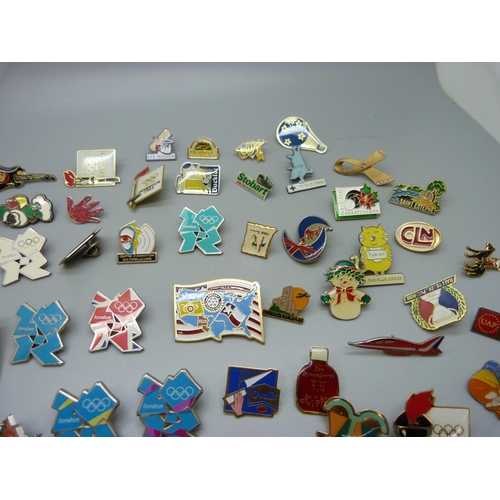 873 - A collection of pin badges