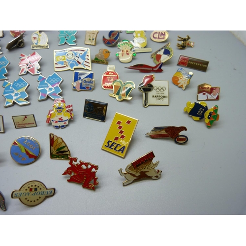 873 - A collection of pin badges